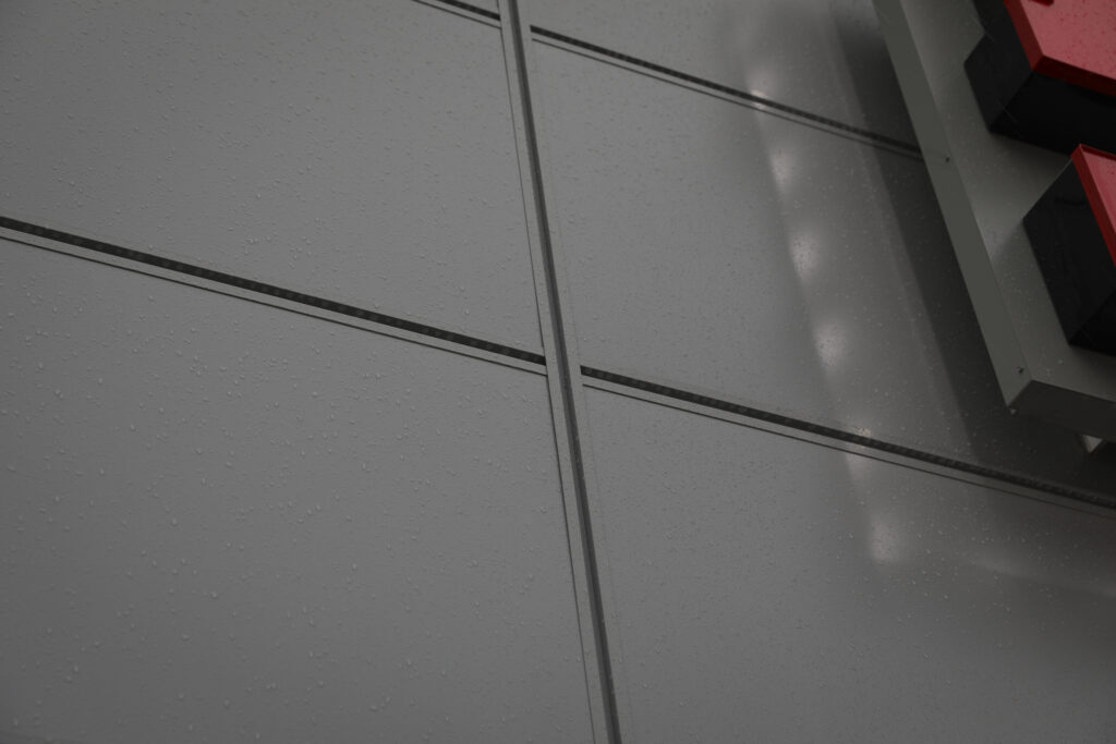 Close-up image of grey metal cladding.