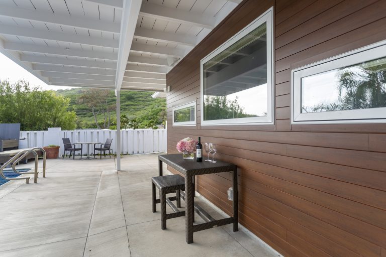 Metal plank house with table and chair