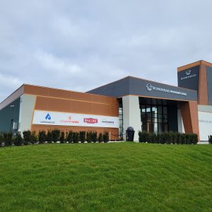 Commercial building with metal panel siding in woodgrain and gray