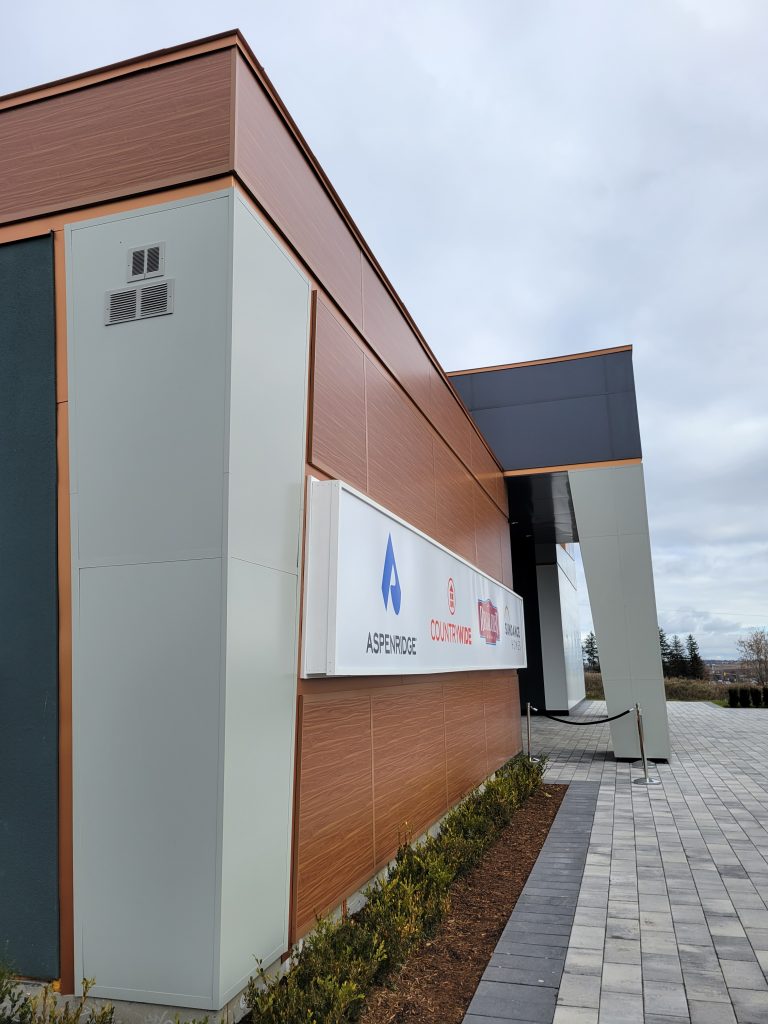 Side view of a commercial building with metal panel siding