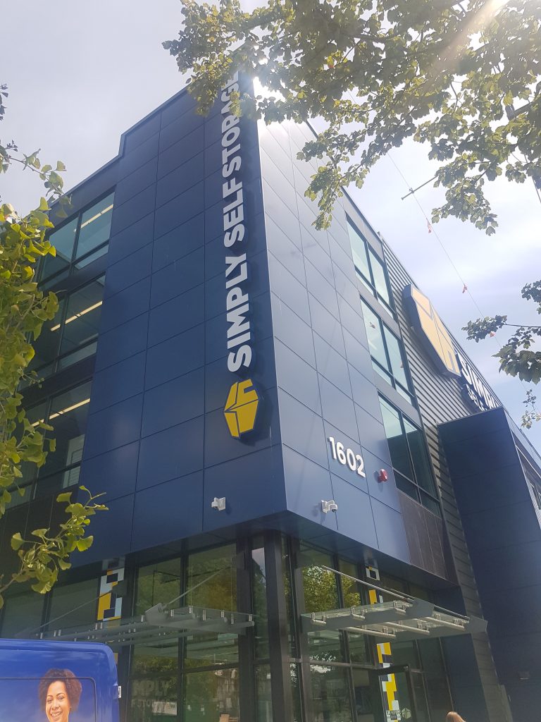 3 story building with navy blue metal cladding