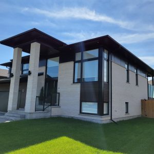 Single family house with white metal cladding